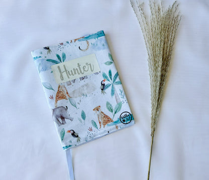 Plunket/Well Child book cover in a zoo animal print with elephants, cheetahs and birds